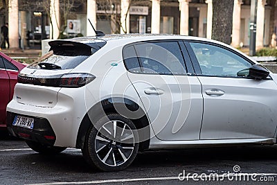 Rear view of white Peugeot e208 parked in the street, Peugeot is the famous french brand of cars of the psa group Editorial Stock Photo