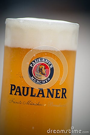 Glass of french beer from Paulaner` brand at restaurant terrace Editorial Stock Photo