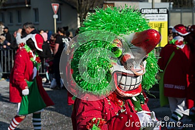 Masked people parading in the street Editorial Stock Photo