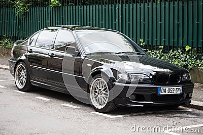 Front view of black BMW 330d parked in the street Editorial Stock Photo