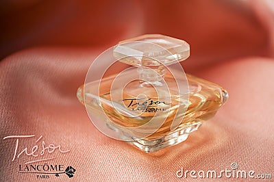 Tresor de Lancome bottle of perfume on satin background Editorial Stock Photo