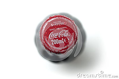 Drops of water on Cocacola capsule on white background on top view Editorial Stock Photo