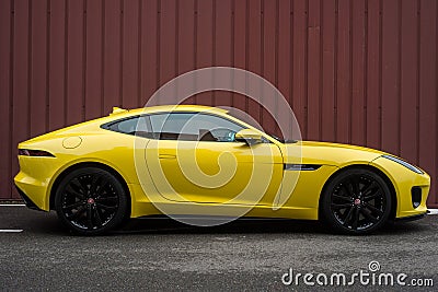 Profile view of yellow Jaguar F-Type parked in the street Editorial Stock Photo