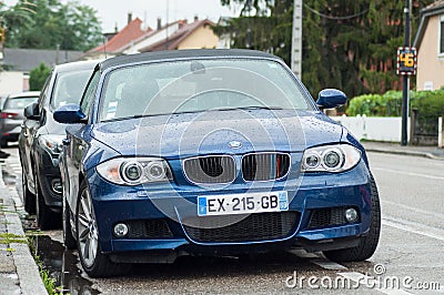 Front view of blue convertible BMW parked in the street Editorial Stock Photo