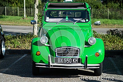 Front view of green citroen 2CV parked in the street Editorial Stock Photo