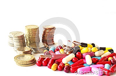 Muliti color pills and money Stock Photo