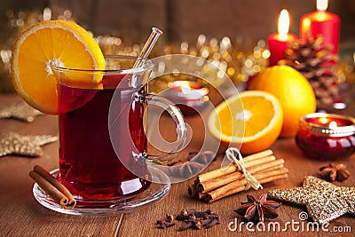 Mulled wine or glÃ¼hwein on a rustic table Stock Photo