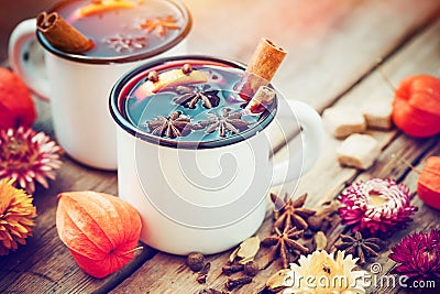 Mulled wine in mugs, spice and dry flowers. Stock Photo