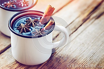 Mulled wine in white mugs with spices and citrus fruit. Stock Photo