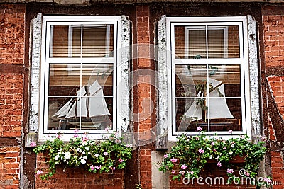 Mullioned windows in an old half timbered house Stock Photo