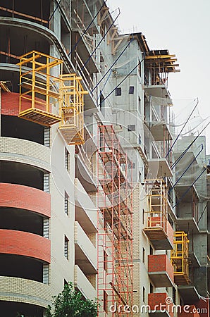 A multi-apartment building under construction, vertical photography. Stock Photo