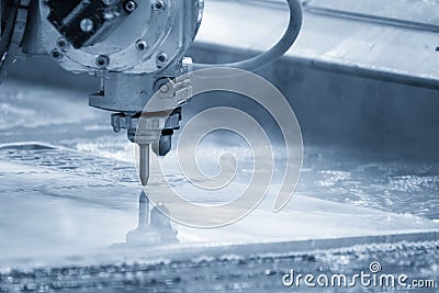 The multi-axis waterjet cutting machine cutting the aluminum plate Stock Photo