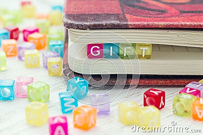 Multi-colored Blocks with the word Gift. Stock Photo