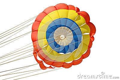 Multi-colored blue red yellow color of an isolated parachute with slings with strong ropes, the parachute is open due to the flow Stock Photo