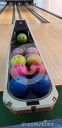 Multi colored bowling balls view in a sport hall Editorial Stock Photo