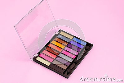 Multi-colored eye shadow palette. Bright colors and shades in cosmetics. Minimalism cosmetic concept. Stock Photo