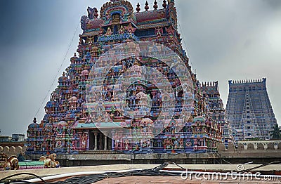 Multi colored gods and goddesses adorn the gopuram Stock Photo