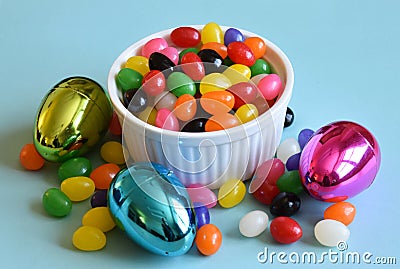 Multi colored jelly beans and Easter eggs Stock Photo