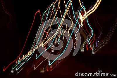 Multi-colored light wavy lines resulting from blurring of light sources due to camera movement Stock Photo