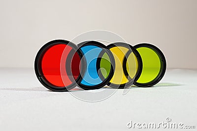 Multi-colored optical filters for a telescope close-up on a white background Stock Photo