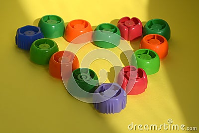 Multi-colored plastic corks from baby food, zero life-style waste, recycling garbage Stock Photo