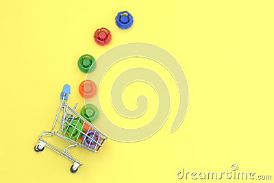 Multi-colored plastic corks from baby food, zero life-style waste, recycling garbage, environmental awareness Stock Photo