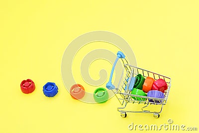 Multi-colored plastic corks from baby food, zero life-style waste, recycling garbage, environmental awareness Stock Photo