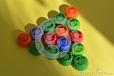 Multi-colored plastic corks from baby food, zero life-style waste, recycling garbage Stock Photo