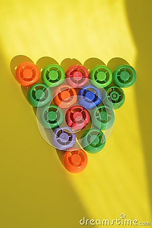 Multi-colored plastic corks from baby food, zero life-style waste, recycling garbage Stock Photo