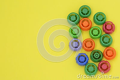 Multi-colored plastic corks from baby food, zero life-style waste, recycling garbage Stock Photo