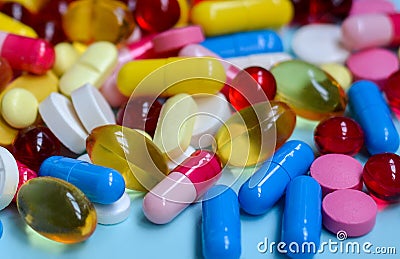 Multi-colored tablets, capsules, vitamins, supplements. Ð¡oncept of treatment and healthcare Stock Photo