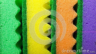 Multi-colored washcloths are laid out in rows on a bright background, close-up. place for text. Copy space Stock Photo