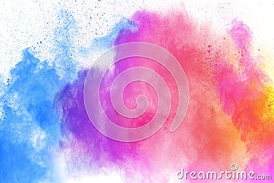 Multi colour powder explosion on white background. Launched colourful dust particles splashing Stock Photo