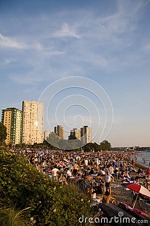 Multi-cultural crowd gathers at Sunset on English Bay, Vancouver Editorial Stock Photo