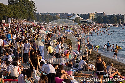 Multi-cultural crowd gathers at Sunset on English Bay, Vancouver Editorial Stock Photo