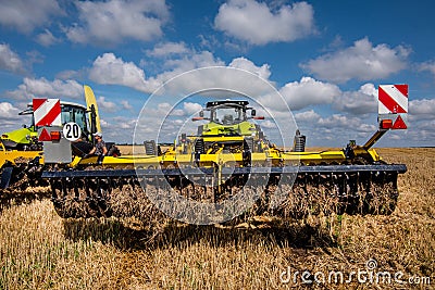 multi-disc cultivator, tillage system with tractor in field Stock Photo