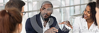 Multi ethnic employees involved in corporate training in boardroom Stock Photo