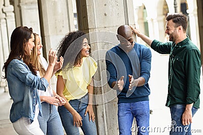 Multi-ethnic group of friends having fun together outdoors Stock Photo