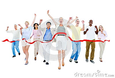 Multi-ethnic group of people running to finish line Stock Photo