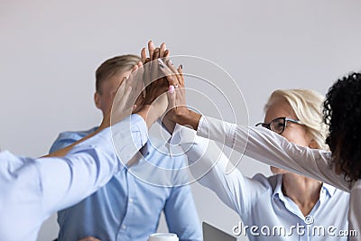 Workmates feels happy giving high five celebrating great work results Stock Photo
