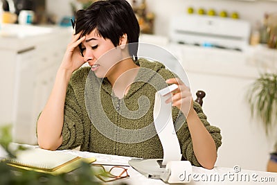 Multi-ethnic Young Woman Agonizing Over Financials Stock Photo