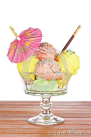 Multi flavor ice cream glass with umbrella Stock Photo