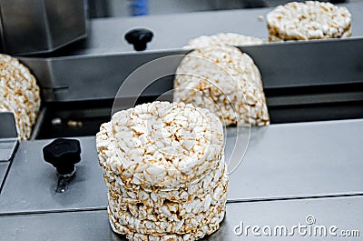 Multi functional automated food system. automatic food Grade Conveyor for the production of useful whole grain extruder crispbread Stock Photo