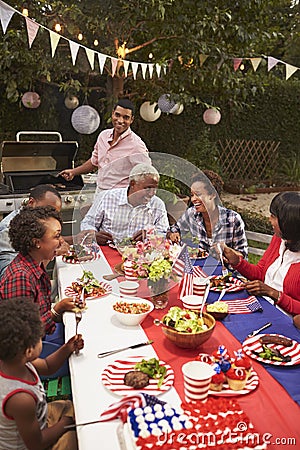 Multi generation black family at 4th July barbecue, vertical Stock Photo