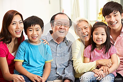 Multi-Generation Chinese Family Relaxing At Home Stock Photo