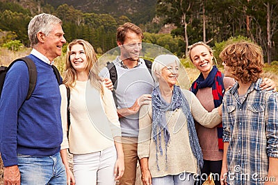 Multi-generation family bonding with each other in a forest Stock Photo