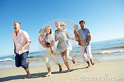 Multi Generation Family Enjoying Beach Holiday Stock Photo