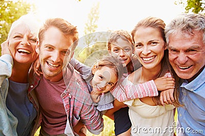 Multi-generation family having fun together outdoors Stock Photo