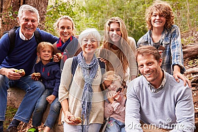 Multi-generation family with teens eating outdoors together Stock Photo