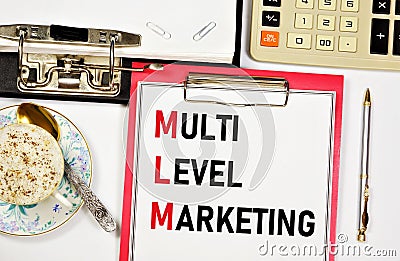 Multi-level marketing. A text label in a working notebook. Stock Photo